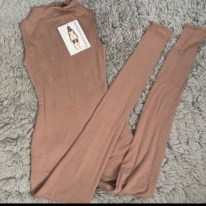 naked wardrobe full tan body suite/ jumpsuit never worn, took the tags off tho